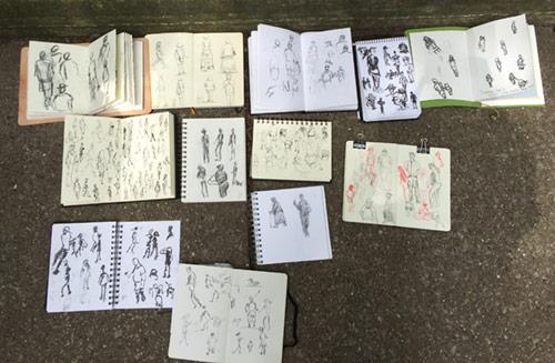 The various sketchbooks from participants depicting people during the Urban Sketchers Chicago event
