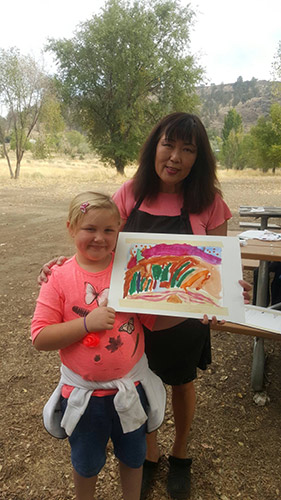 Painting outdoors with children
