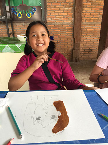 Creating art in a children’s shelter in Chiang Mai, Thailand