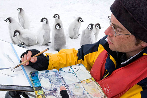 McEown painting emperor penguin chicks in Antarctica. Photo by Daisy Gilardini