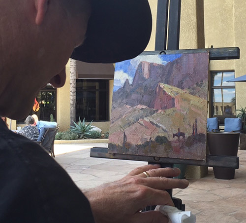 Jim Wodark painting on location in Tucson. Photo by David Thibault