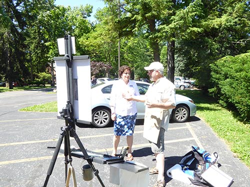 Robin Roberts, President of the Ohio Plein Air Society, talks with Executive Director Christie M. Meininger.