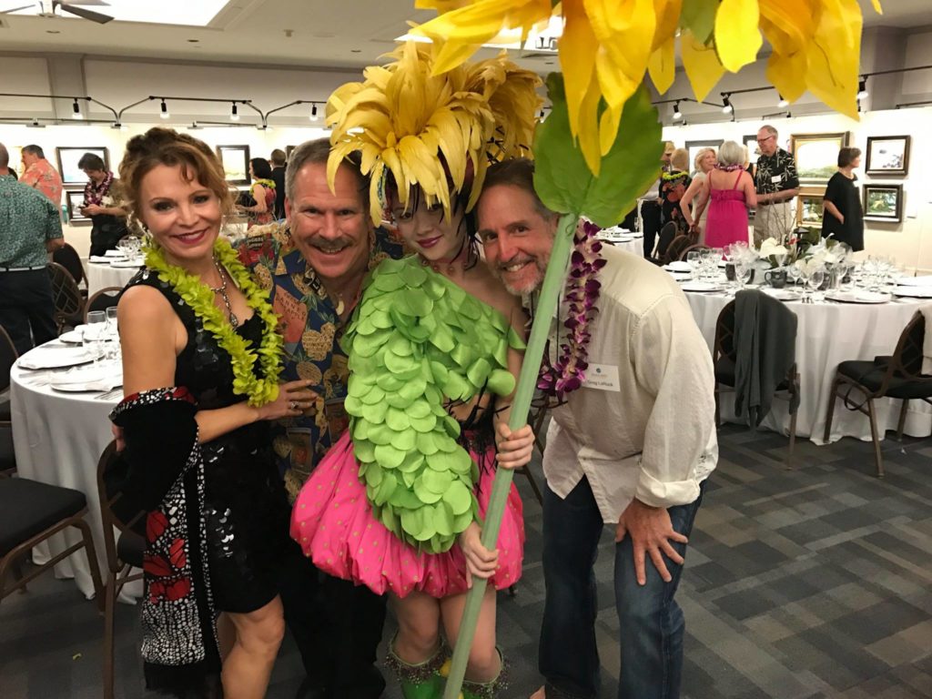 Andrea Holden Haigh, Chris Haigh, and Greg LaRock visit with Flower Power, a performer with IONA Contemporary Dance Theatre at the event’s gala