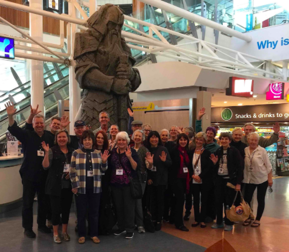 Cheery and enthusiastic after a 14-hour flight from Los Angeles, part of the group meets for the first time at the stone guard from Weta in the Auckland Airport. 