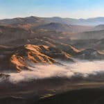Atmospheric painting of a mountain landscape by Richard Schloss