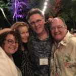 Artist with painting buyers