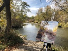 Watercolor painting on an easel by Indiana river