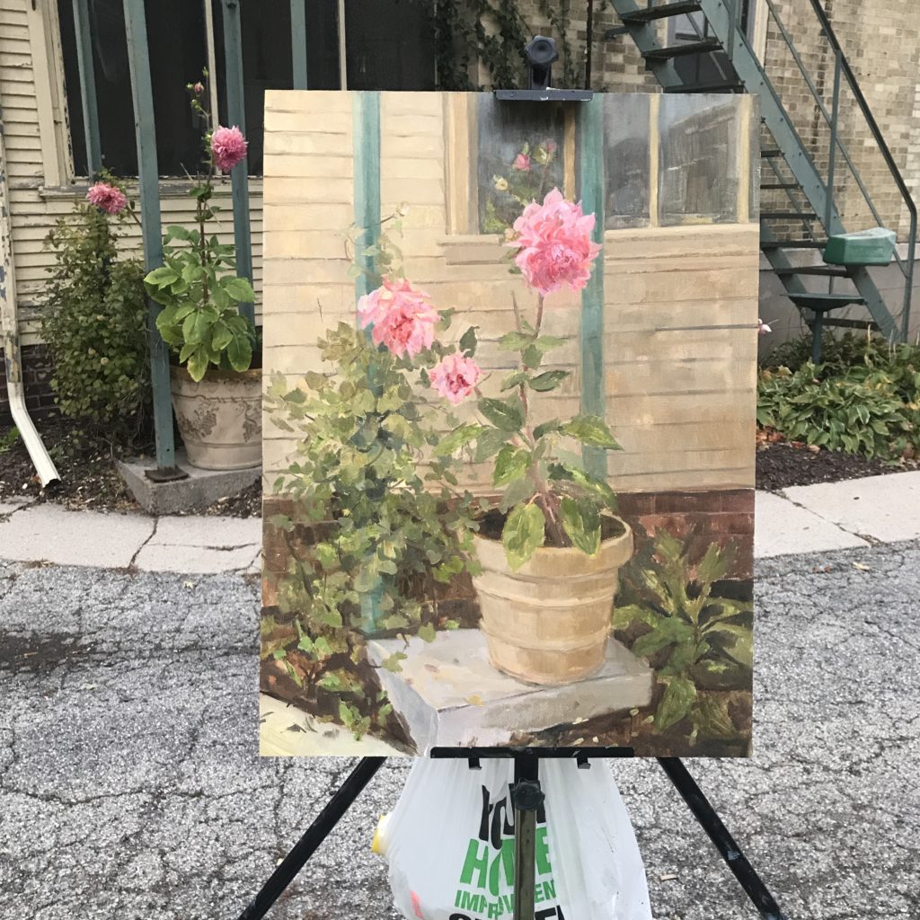 Oil painting of dahlias on easel