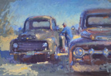 Oil painting of two old Ford trucks