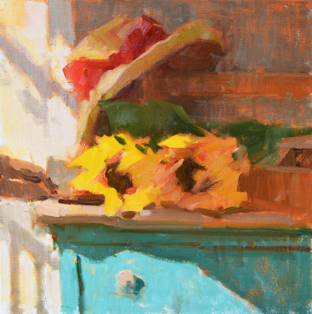 Oil painting of sunflowers on a stand with a straw hat