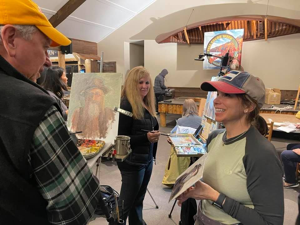 Kellee Crosby Mayfield showing her portrait of Joe to Eric; photo courtesy of Elaine Miller