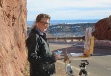 Woman painting outdoors in Red Rocks Park