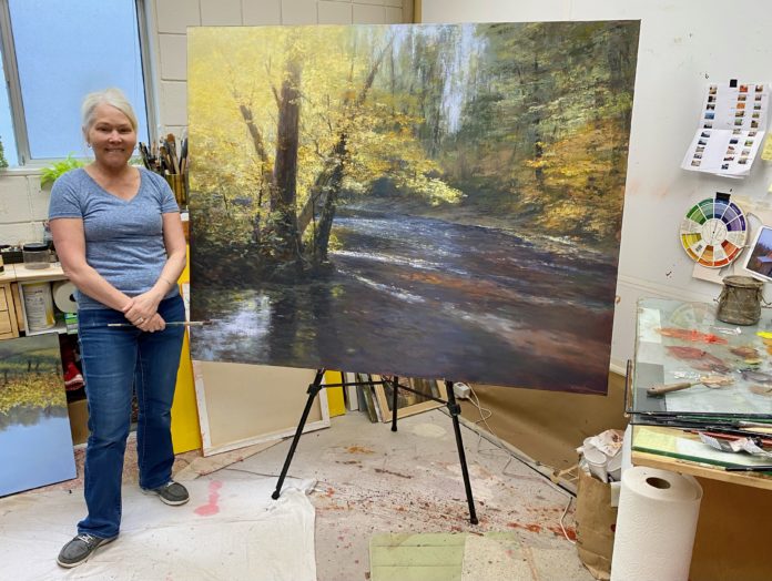 Brenda Boylan with her new painting, 