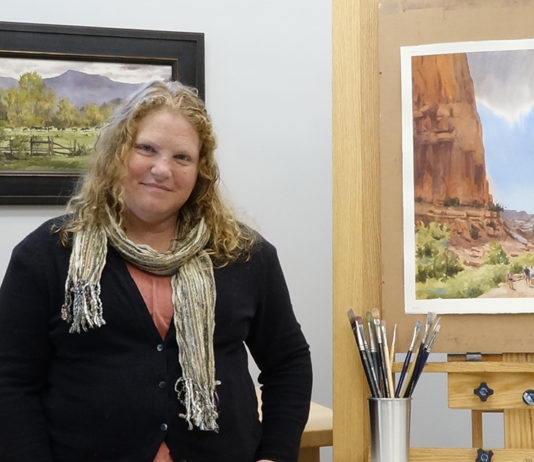 Brienne Brown’s studio in Central Pennsylvania with her watercolor paintings, "Enfolding Green Pastures" (framed) and "Day for Exploring"