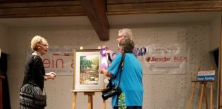 Steve Puttrich winning an award during a recent painting competition