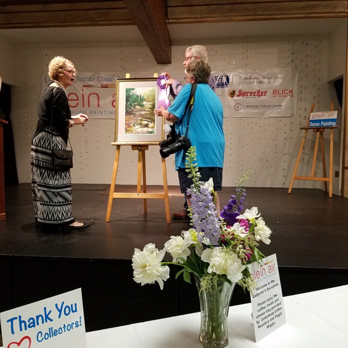Steve Puttrich winning an award during a recent painting competition