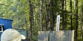 Artist John Guernsey painting historic cabin in Elkmont