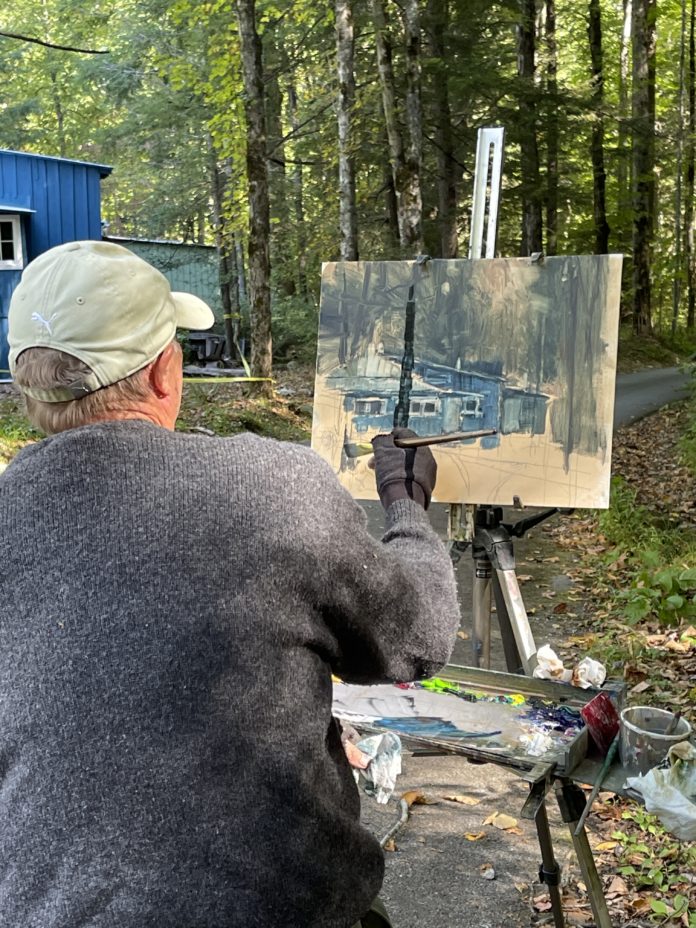 Artist John Guernsey painting historic cabin in Elkmont
