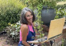 Artist Spotlight: Lynn Dunbar Bayus Artist posing for a photo while painting