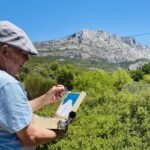 John MacArthur doing what he loves: painting outside