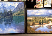 Kim Casebeer with two paintings
