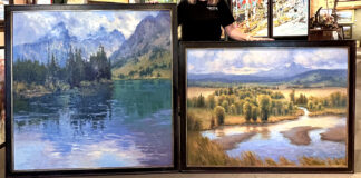 Kim Casebeer with two paintings