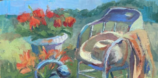 oil painting of still life: lan chair, flowers and watering can outside in a field