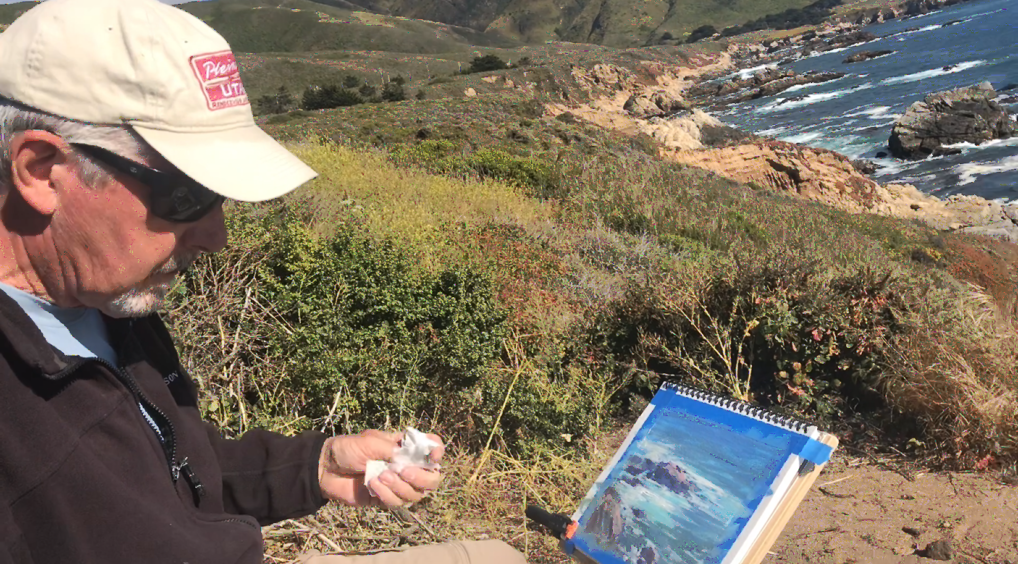 John Hughes painting an acrylic sketch near Point Lobos California
