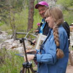 how to carry wet canvas panels - Eric Rhoads painting alongside others during the 2023 Plein Air Convention & Expo