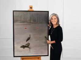 Artist Spotlight: Sherry Mason Sherry posing with her painting