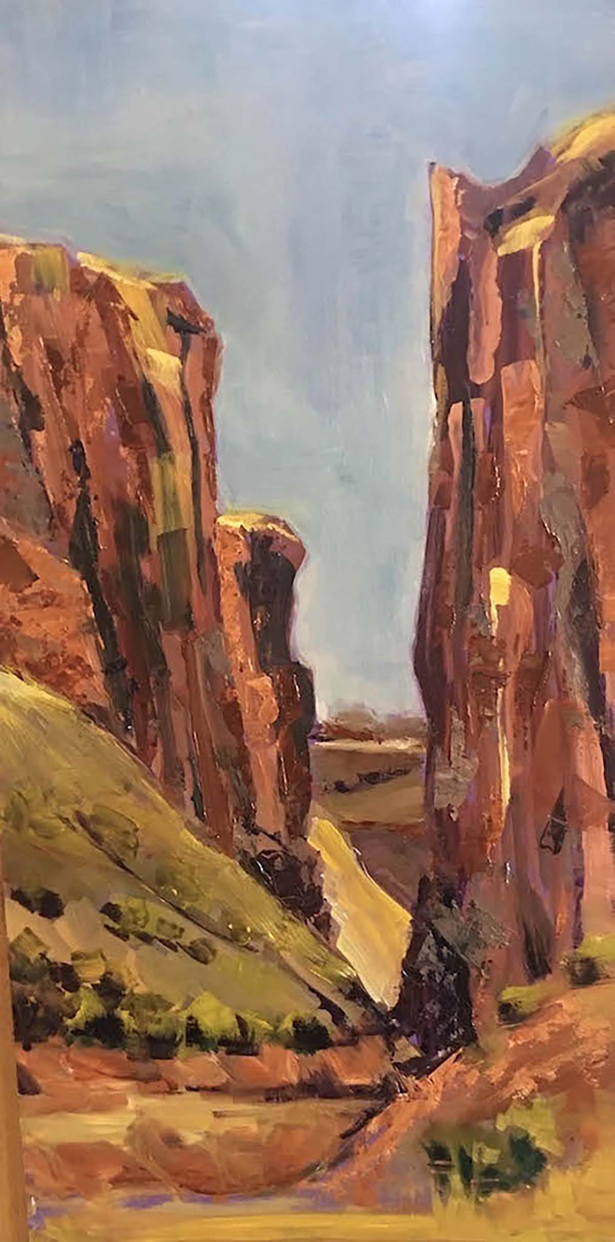 oil painting of desert landscape; two mountain peaks with path leading through