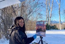 Photo of myself painting Mt Washington “en plein air” in the winter. Standing on a bath matt helps keeps my feet warm