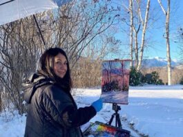 Photo of myself painting Mt Washington “en plein air” in the winter. Standing on a bath matt helps keeps my feet warm
