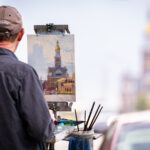 Farley Lewis painting the Courthouse Bluff durint the 2023 Bluff Strokes Quick Paint
