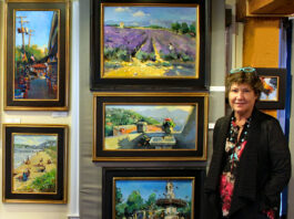 photo of artist with her plein air paintings