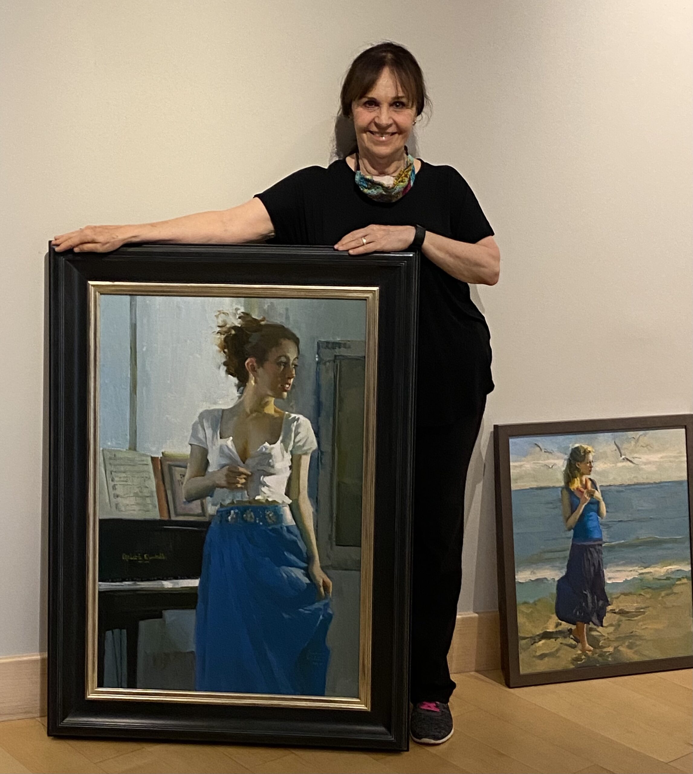 Nancy Seamons Crookston with one of her paintings