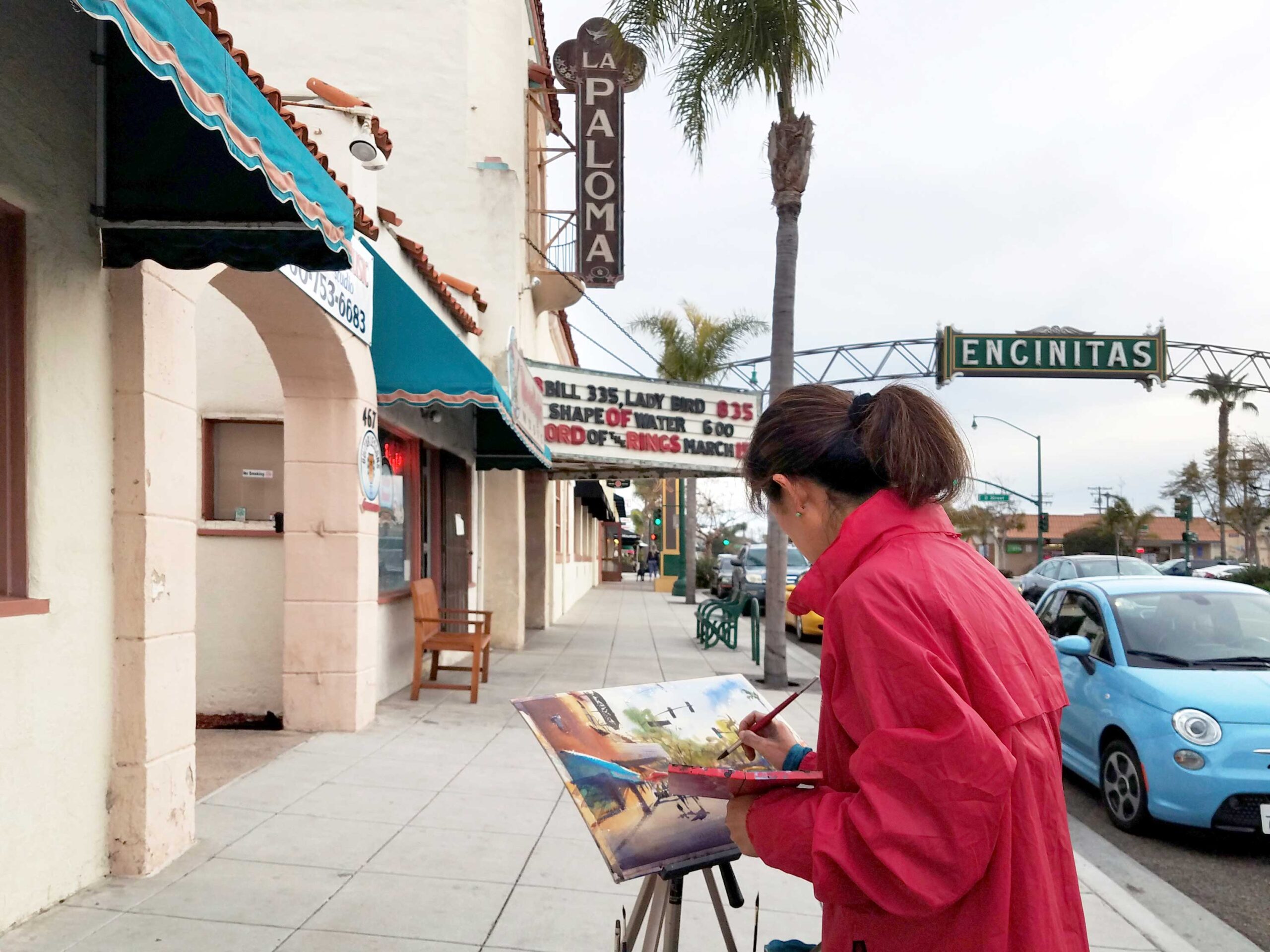 Keiko Tanabe paints La Paloma Theatre, a historic Spanish Colonial Revival-style movie theater in Encinitas, California.