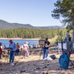 Artists painting together during one of the 2025 Plein Air Convention & Expo (PACE) paint-outs.
