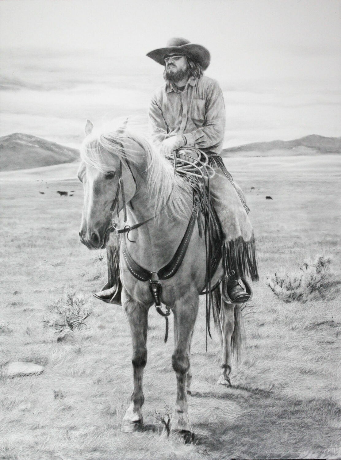 A cowboy wearing a wide-brimmed hat and chaps sits atop a saddled horse in an open grassy plain, with distant hills and grazing cattle in the background. The image is in black and white. 15th Annual PleinAir Salon Art Competition