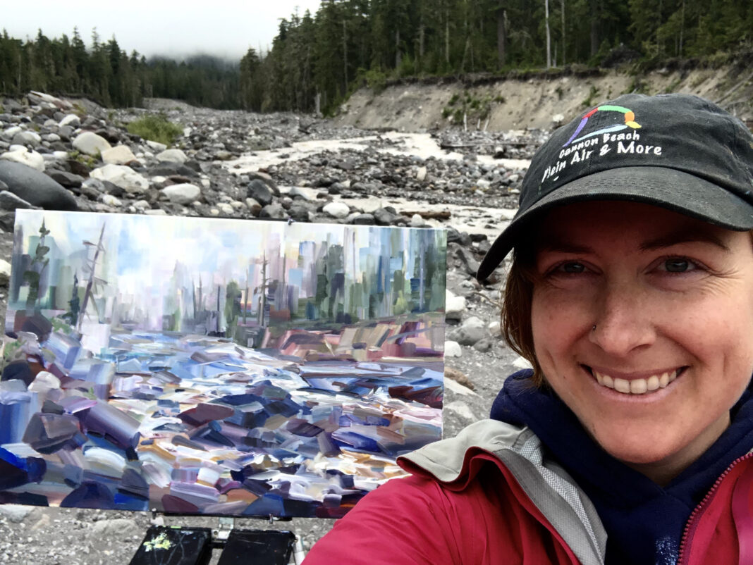 Artist Brook Borcherding painting mist along the river at Mt. Rainier