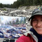 Artist Brook Borcherding painting mist along the river at Mt. Rainier