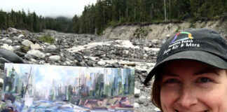 Artist Brook Borcherding painting mist along the river at Mt. Rainier