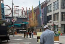One of the artists painting on location at Denver Pavilions