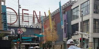 One of the artists painting on location at Denver Pavilions