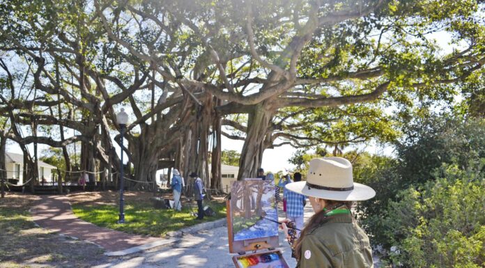 Artist Kari Ganoung Ruiz plein air painting during the Lighthouse Paint Out Competition at Jupiter Inlet Lighthouse Museum