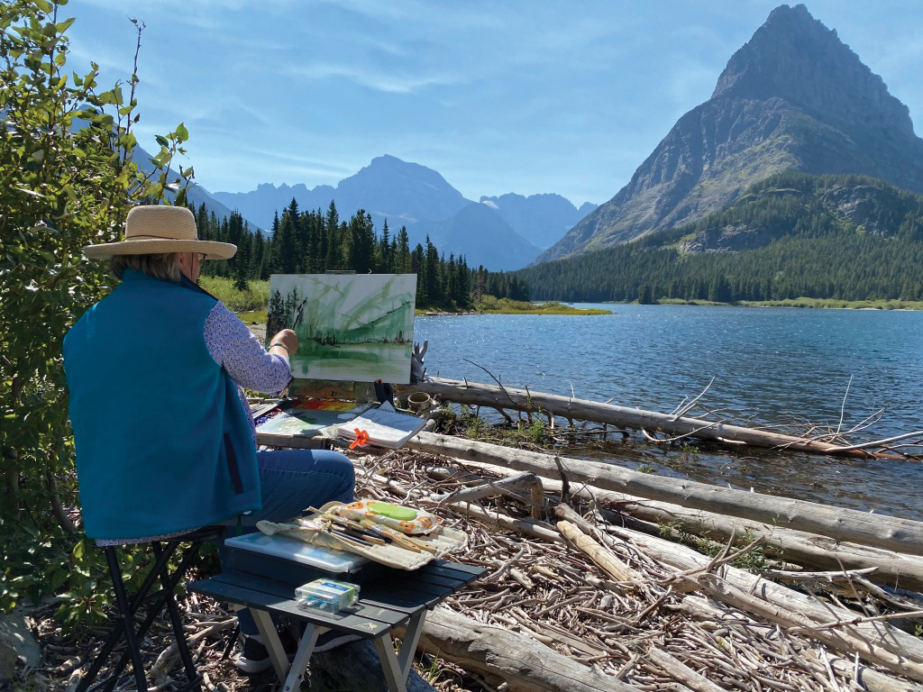 Kathie painting at Swiftcurrent Lake, Glacier National Park, Montana, in 2021