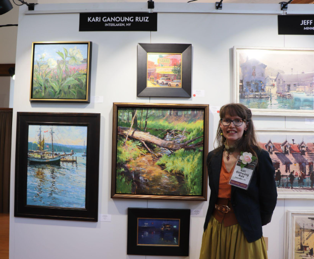 Kari Ganoung Ruiz at her wall during Paint Grand Traverse. Photo credit: Judy Kelly
