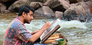 The artist painting on location