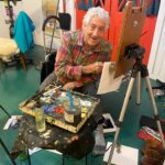 We Remember Gil Dellinger (1942-2026) Gil Dellinger artist obituary - at the easel - image courtesy of the Dellinger family