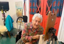 Gil Dellinger artist obituary - at the easel - image courtesy of the Dellinger family